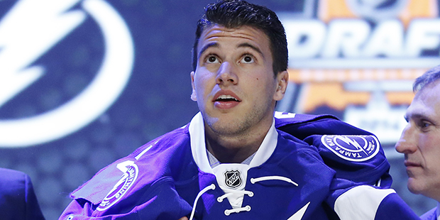Anthony Deangelo pulls on a Tampa Bay Lightning sweater after being chosen 19th overall during the ...