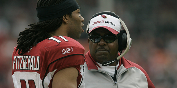 Arizona Cardinals' head coach Dennis Green, right, talks with Larry Fitzgerald in the first quarter...