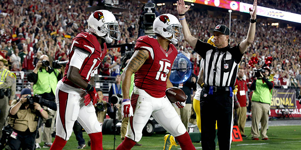 Arizona Cardinals wide receiver Michael Floyd (15) celebrates his touchdown catch with teammate  J....