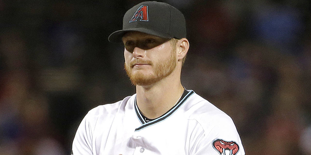 Arizona Diamondbacks starting pitcher Shelby Miller rubs the baseball before coming out of the game...