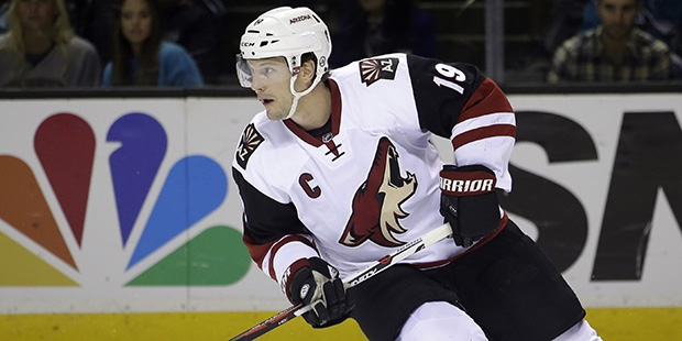 FILE - In this April 9, 2016, file photo, Arizona Coyotes' Shane Doan skates with the puck during a...