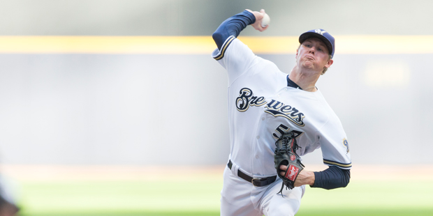 Milwaukee Brewers' Chase Anderson pitches to an Arizona Diamondbacks batter during the first inning...
