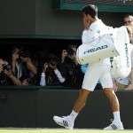 Novak Djokovic of Serbia leaves the court after losing his men's singles match against Sam Querrey of the U.S on day six of the Wimbledon Tennis Championships in London, Saturday, July 2, 2016. (AP Photo/Alastair Grant)