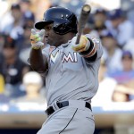 National League's Marcell Ozuna, of the Miami Marlins, follows through on an RBI single during the fourth inning of the MLB baseball All-Star Game, Tuesday, July 12, 2016, in San Diego. (AP Photo/Gregory Bull)