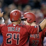 Arizona Diamondbacks' Brandon Drury (27) celebrates his two-run home run against the San Diego Padres with Yasmany Tomas (24) during the third inning of a baseball game Wednesday, July 6, 2016, in Phoenix. (AP Photo/Ross D. Franklin)