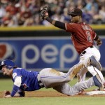 Toronto Blue Jays' Josh Donaldson is safe at second on a base hit by teammate Russell Martin during the fifth inning of an interleague baseball game as Arizona Diamondbacks' Jean Segura (2) holds up the ball after the play, Wednesday, July 20, 2016, in Phoenix. (AP Photo/Matt York)