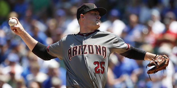 Arizona Diamondbacks starter Archie Bradley throws against the Chicago Cubs during the first inning...