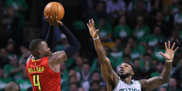 Atlanta Hawks Paul Millsap shoots for two over Boston Celtics Jae Crowder during the first half in ...
