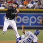 Arizona Diamondbacks' Nick Ahmed, left, throws to first base after forcing out Los Angeles Dodgers' Howie Kendrick (47) during the fourth inning of a baseball game Saturday, July 16, 2016, in Phoenix. Andrew Toles was safe at first. (AP Photo/Ross D. Franklin)