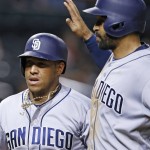 San Diego Padres' Yangervis Solarte, left, gets a slap on the helmet from Matt Kemp, right, after Solarte's three-run home run against the Arizona Diamondbacks during the ninth inning of a baseball game Wednesday, July 6, 2016, in Phoenix. The Padres defeated the Diamondbacks 13-6. (AP Photo/Ross D. Franklin)