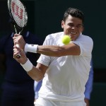 Milos Raonic of Canada plays a return to Andy Murray of Britain during the men's singles final on the fourteenth day of the Wimbledon Tennis Championships in London, Sunday, July 10, 2016. (AP Photo/Ben Curtis)