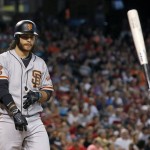 San Francisco Giants' Brandon Crawford tosses his bat after striking out against the Arizona Diamondbacks during the fourth inning of a baseball game Sunday, July 3, 2016, in Phoenix. (AP Photo/Ross D. Franklin)