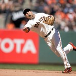 San Francisco Giants' Ramiro Pena makes an off-balance throw too late to get Arizona Diamondbacks' Jean Segura at first base during the seventh inning of a baseball game Saturday, July 9, 2016, in San Francisco. Pena was charged with an error on the play. The Giants won 4-2. (AP Photo/D. Ross Cameron)