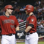Arizona Diamondbacks' Paul Goldschmidt (44) celebrates his run scored against the San Diego Padres with Brandon Drury during the first inning of a baseball game Wednesday, July 6, 2016, in Phoenix. (AP Photo/Ross D. Franklin)