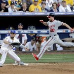 National League's Daniel Murphy, of the Washington Nationals, beats the throw to first as American League's Eric Hosmer, of the Kansas City Royals, waits for the throw during the fifth inning of the MLB baseball All-Star Game, Tuesday, July 12, 2016, in San Diego. Murphy reached on a fielding error by Jose Altuve. (AP Photo/Jae C. Hong)