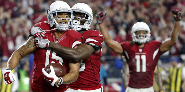 Arizona Cardinals wide receiver Michael Floyd (15) celebrates his touchdown catch with Jaron Brown ...