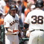 San Francisco Giants' Jake Peavy, left, celebrates a two-run home by teammate Grant Green (38) against the Arizona Diamondbacks during the fourth inning of a baseball game on Saturday, July 9, 2016, in San Francisco.  (AP Photo/D. Ross Cameron)