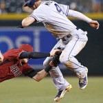 Arizona Diamondbacks' Nick Ahmed, left, reaches out to tag San Diego Padres' Wil Myers (4) out, but the play was ruled dead by a foul ball hit by Padres' Matt Kemp, during the ninth inning of a baseball game Wednesday, July 6, 2016, in Phoenix. The Padres defeated the Diamondbacks 13-6. (AP Photo/Ross D. Franklin)