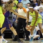 Dallas Wings forward Glory Johnson, right, is defended by Phoenix Mercury center Brittney Griner during the first half of a WNBA basketball game in Arlington, Texas, Tuesday, July 5, 2016. (AP Photo/LM Otero)