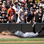 Arizona Diamondbacks' Brandon Drury can't make a diving catch of a foul popup in the bullpen during the sixth inning of a baseball game against the San Francisco Giants on Saturday, July 9, 2016, in San Francisco. The Giants won 4-2. (AP Photo/D. Ross Cameron)