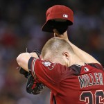 Arizona Diamondbacks' Shelby Miller wipes sweat from his forehead as he struggles, giving up five runs to the San Diego Padres, during the fourth inning of a baseball game Wednesday, July 6, 2016, in Phoenix. (AP Photo/Ross D. Franklin)