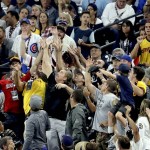 Fans reach for a foul ball during the eighth inning during the MLB baseball All-Star Game, Tuesday, July 12, 2016, in San Diego. (AP Photo/Jae C. Hong)