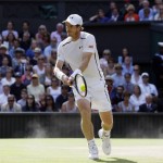 Andy Murray of Britain hits a return to Milos Raonic of Canada during the men's singles final on the fourteenth day of the Wimbledon Tennis Championships in London, Sunday, July 10, 2016. (AP Photo/Kirsty Wigglesworth)