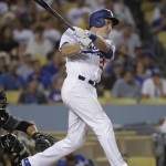 Los Angeles Dodgers' Chase Utley follows through on a two-run home run during the seventh inning of a baseball game against the Arizona Diamondbacks, Friday, July 29, 2016, in Los Angeles. (AP Photo/Jae C. Hong)