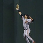 San Francisco Giants' Jarrett Parker makes a leaping catch on a fly ball hit by Arizona Diamondbacks' Jake Lamb during the sixth inning of a baseball game Sunday, July 3, 2016, in Phoenix. (AP Photo/Ross D. Franklin)