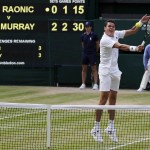 Milos Raonic of Canada hits a return to Andy Murray of Britain during the men's singles final on the fourteenth day of the Wimbledon Tennis Championships in London, Sunday, July 10, 2016. (AP Photo/Ben Curtis)