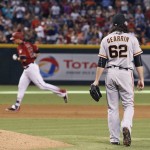 San Francisco Giants' Cory Gearrin (62) walks around the mound after giving up a two-run home run to Arizona Diamondbacks' Jake Lamb, left, during the eighth inning of a baseball game Sunday, July 3, 2016, in Phoenix. (AP Photo/Ross D. Franklin)