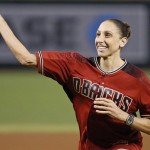 United States women's Olympic basketball team player and Phoenix Mercury's Diana Taurasi throws out a ceremonial first pitch prior to a baseball game between the Arizona Diamondbacks and the Los Angeles Dodgers, Sunday, July 17, 2016, in Phoenix. (AP Photo/Ross D. Franklin)
