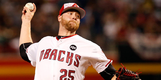 Arizona Diamondbacks pitcher Archie Bradley throws in the first inning during a baseball game again...
