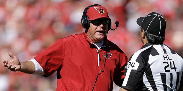 FILE - In this Oct. 13, 2013 file photo, Arizona Cardinals head coach Bruce Arians, left, argues wi...
