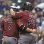 Arizona Diamondbacks' Yasmany Tomas is greeted by Welington Castillo after hitting a two-run home run, his second homer of the baseball game, off Milwaukee Brewers' Jimmy Nelson during the fifth inning Wednesday, July 27, 2016, in Milwaukee. (AP Photo/Tom Lynn)