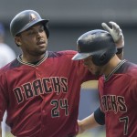 Arizona Diamondbacks' Yasmany Tomas is greeted by Welington Castillo after hitting a three-run home run off of Milwaukee Brewers' Jimmy Nelson during the first inning of a baseball game Wednesday, July 27, 2016, in Milwaukee. (AP Photo/Tom Lynn)
