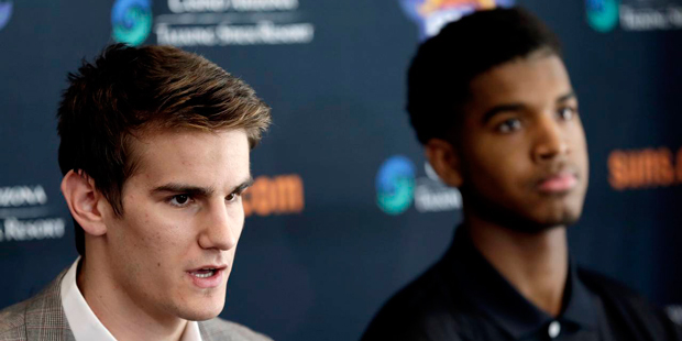 Phoenix Suns' first-round draft picks Dragan Bender, left, and Marquese Chriss are introduced to th...
