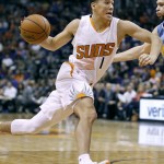 Phoenix Suns' Devin Booker drives to the basket past Denver Nuggets' Kostas Papanikolaou, of Greece, during the second half of an NBA basketball game, Saturday, Nov. 14, 2015, in Phoenix. The Suns defeated the Nuggets 105-81. (AP Photo/Ralph Freso)