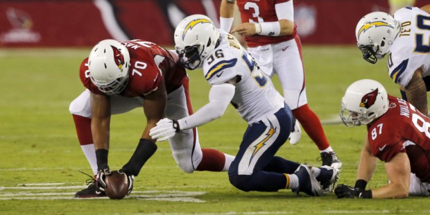 Arizona Cardinals tackle Bobby Massie (70) and San Diego Chargers inside linebacker Donald Butler (...