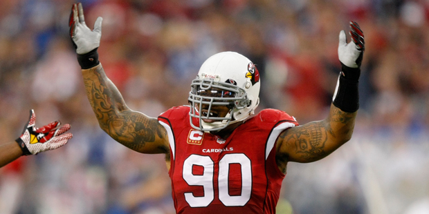 Arizona Cardinals defensive end Darnell Dockett (90) motivates the fans during the first half of an...
