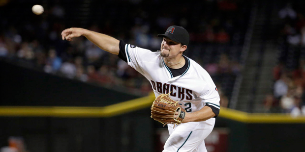 Arizona Diamondbacks Zack Godley throws against the San Diego Padres during the third inning of a b...