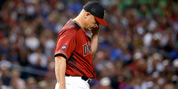 Arizona Diamondbacks manager Chip Hale walks to the mound during the seventh inning of a baseball g...