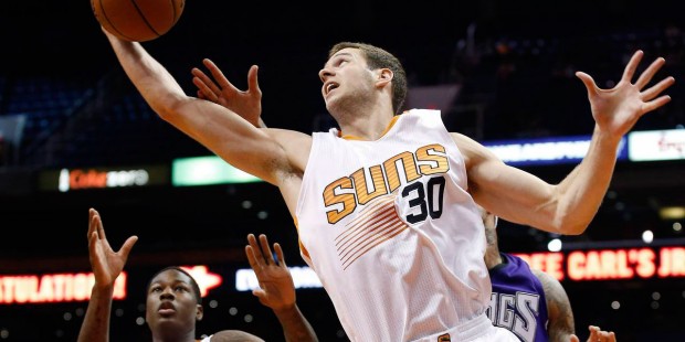 Phoenix Suns' Jon Leuer (30) grabs a rebound against the Sacramento Kings as teammate Archie Goodwi...
