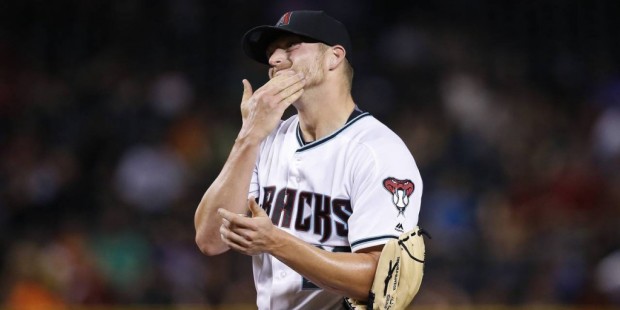 Arizona Diamondbacks' Shelby Miller pauses on the mound after giving up his third home run to the C...