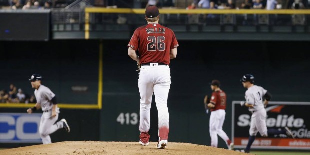 Arizona Diamondbacks' Shelby Miller (26) pauses on the mound after giving up a two-run home run to ...