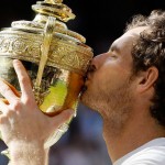 Andy Murray of Britain kisses his trophy after beating Milos Raonic of Canada in the men's singles final on day fourteen of the Wimbledon Tennis Championships in London, Sunday, July 10, 2016. (AP Photo/Kirsty Wigglesworth)