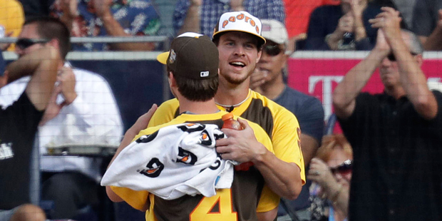 Beau Myers (4) hugs his brother,  Wil Myers, of the San Diego Padres after Beau pitched to Wil duri...