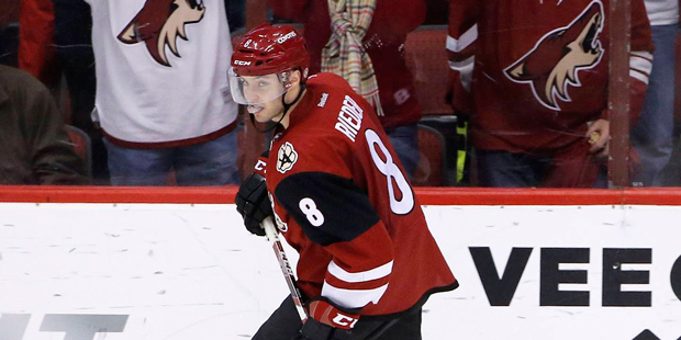 Arizona Coyotes' Tobias Rieder, of Germany, skates past cheering fans after Rieder scored his secon...