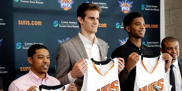 From left to right, Phoenix Suns' second-round draft pick Tyler Ulis and first-round draft picks Dr...