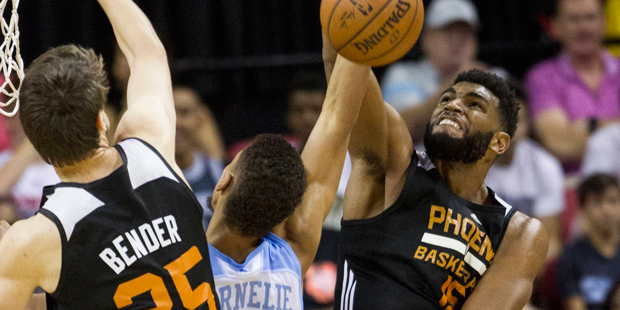 Denver Nuggets' Petr Cornelie (12) gets his shot blocked by Phoenix Suns' Alan Williams (15) during...